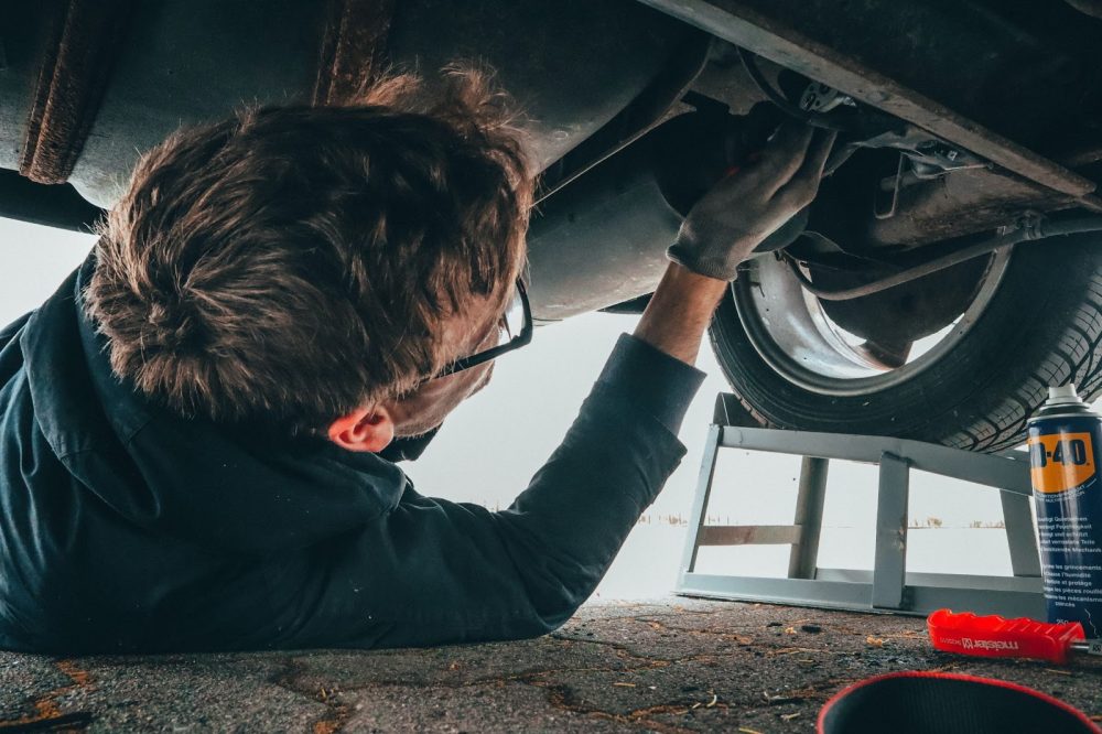 Mechanic under car