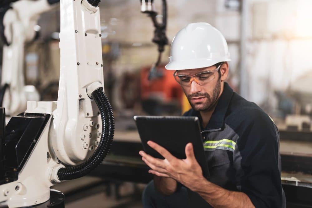 Male welder reviewing paperwork