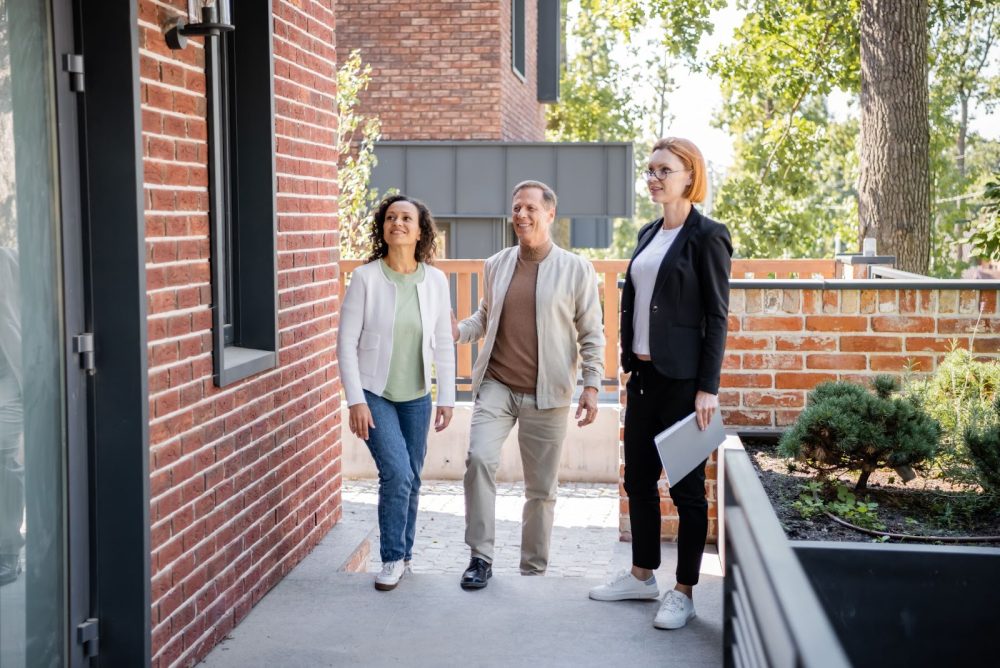 Female freelance real estate agent shows a home