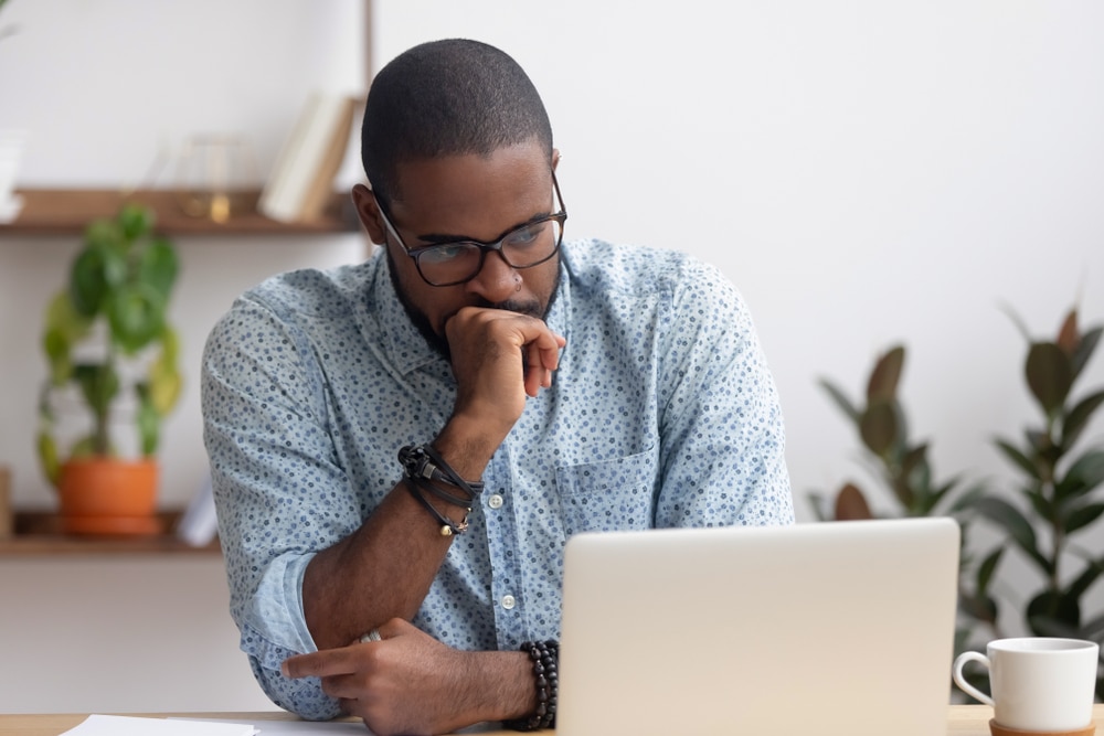 Male pondering Airbnb insurance types