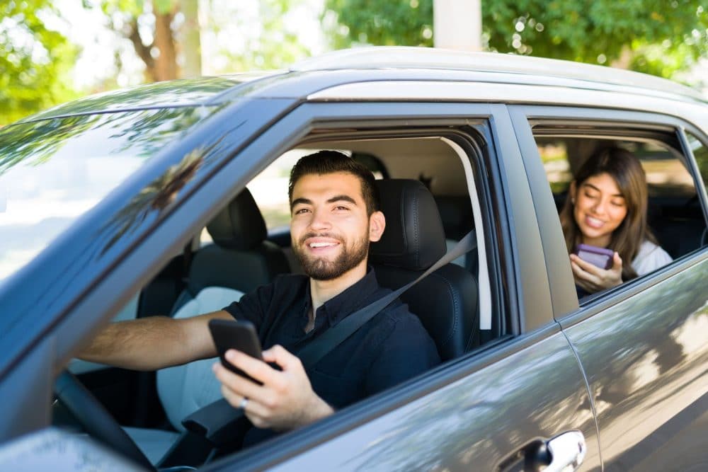 Happy male driver who obtained commercial auto insurance