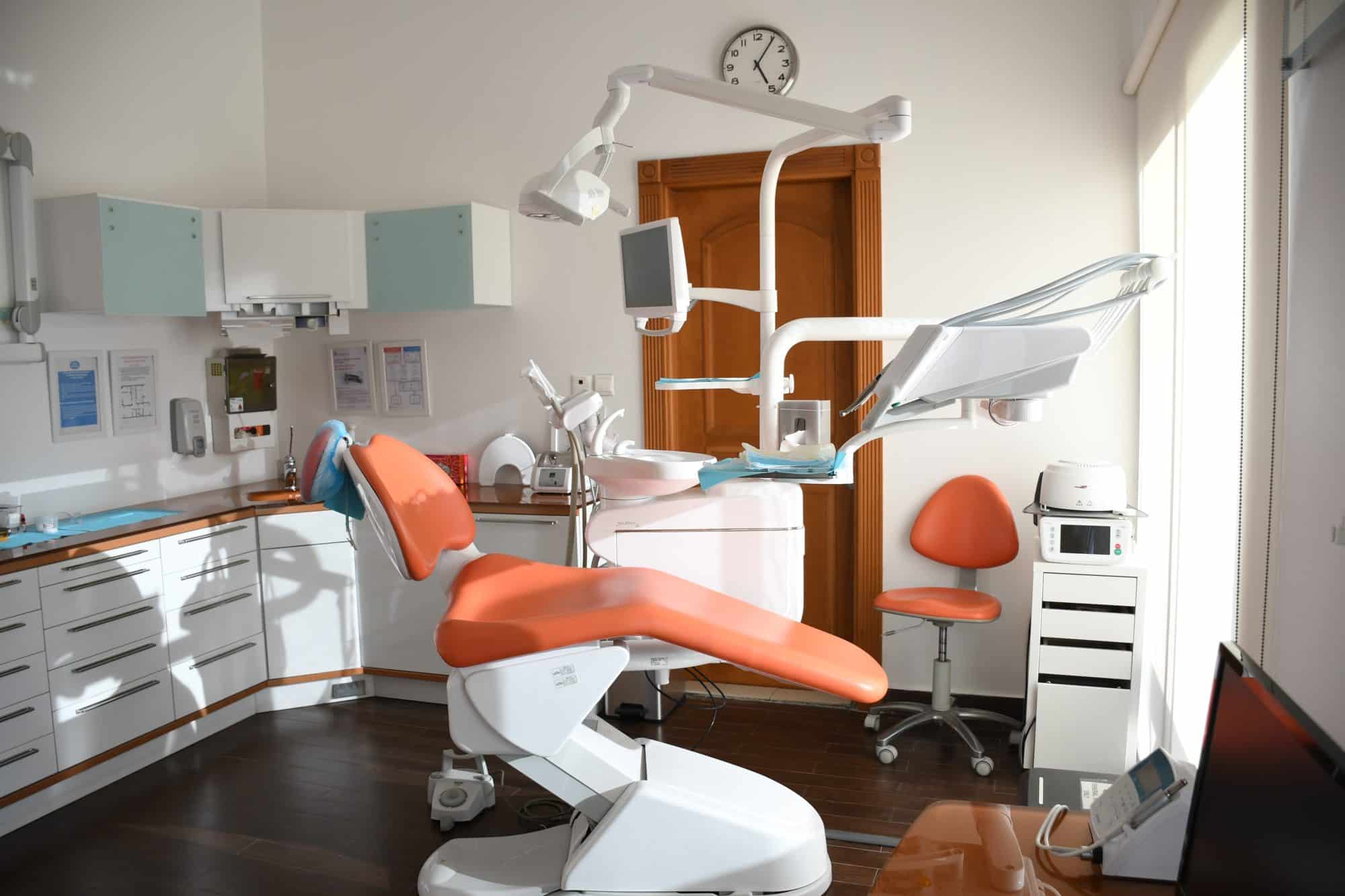 Dental chair for patient pondering dental plan or dental insurance